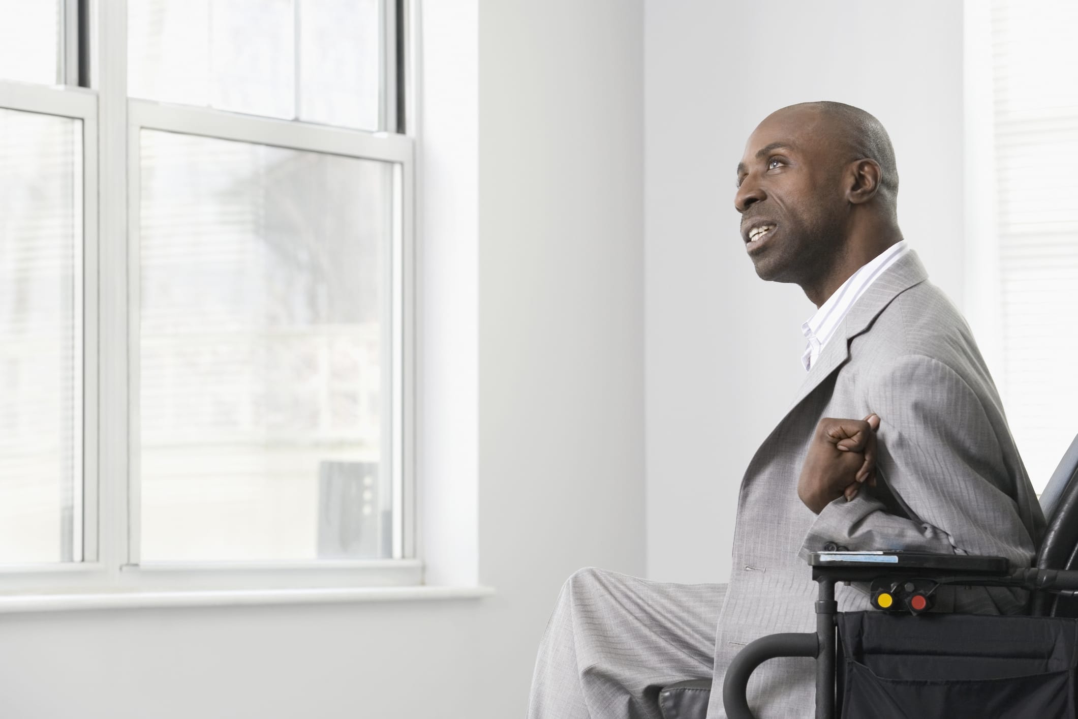 person in wheelchair with severe spasticity